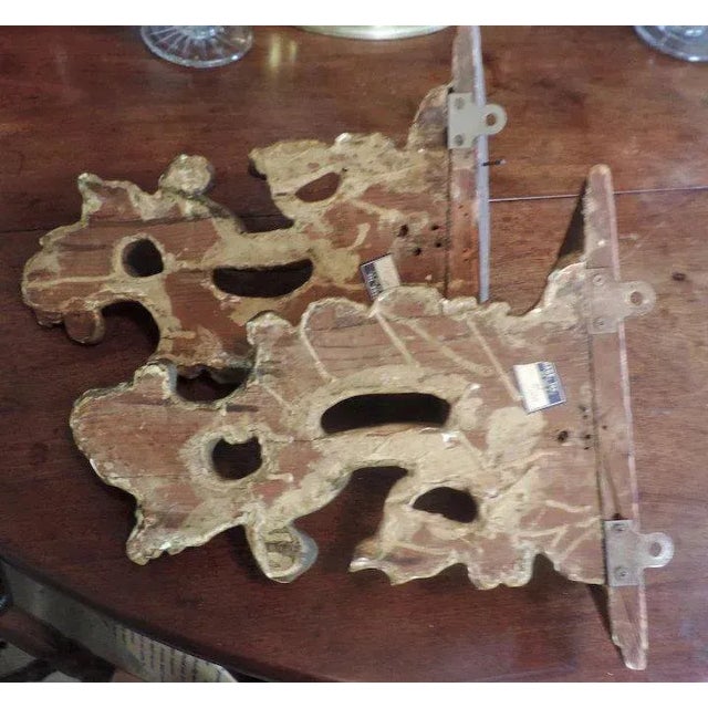 Pair 19th c. carved and gilt wood wall brackets in the Chippendale manner. Each rococo shaped shelf on shell and double...