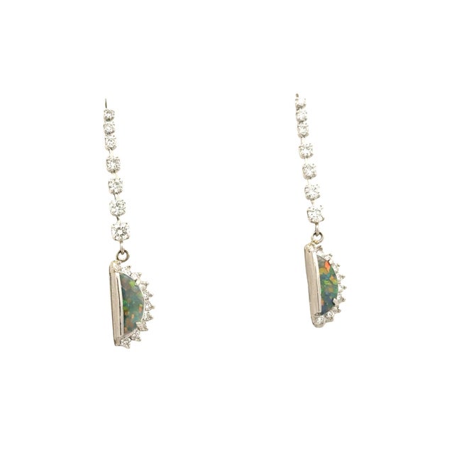 Crafted in platinum, these exquisite drop earrings are a captivating addition to any collection. Featuring 0.86 carats of...