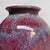 A distinctive Japanese ikebana vase, signed by renowned ceramic artist Noma Gazan, known for his experimental glazes and...