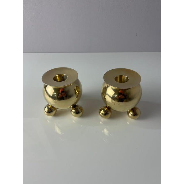 These two spherical candlesticks are true icons of Swedish design, crafted by the renowned Gusums Bruk manufactory....