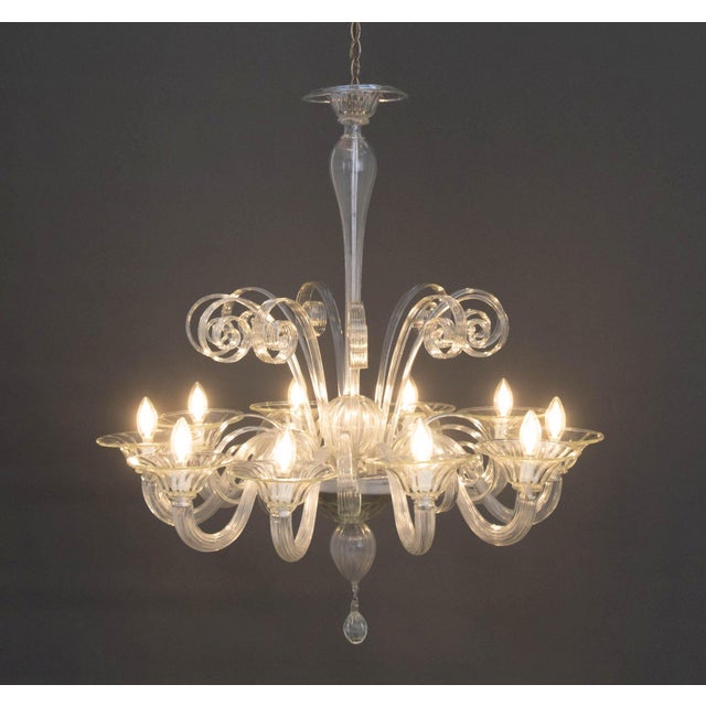 Murano Clear Glass Ten Branch Chandelier, with scroll form accents and drop crystals. 38" H x 35" Diameter. Provenance:...