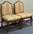 Beautiful pair of American made solid wood chairs feature meticulously carved bamboo detailing and decorative under-seat...