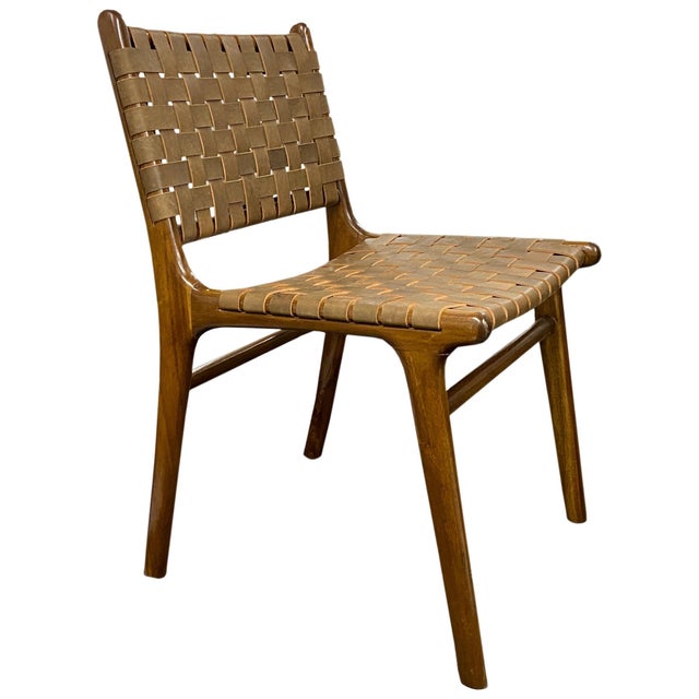 Premium quality leather with teak frame. Two available. The price reflects one. Premium quality leather chair with...