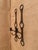 Hermès-style wall-mounted candle sconces with faux leather "straps" made of painted metal. These have been created in the...