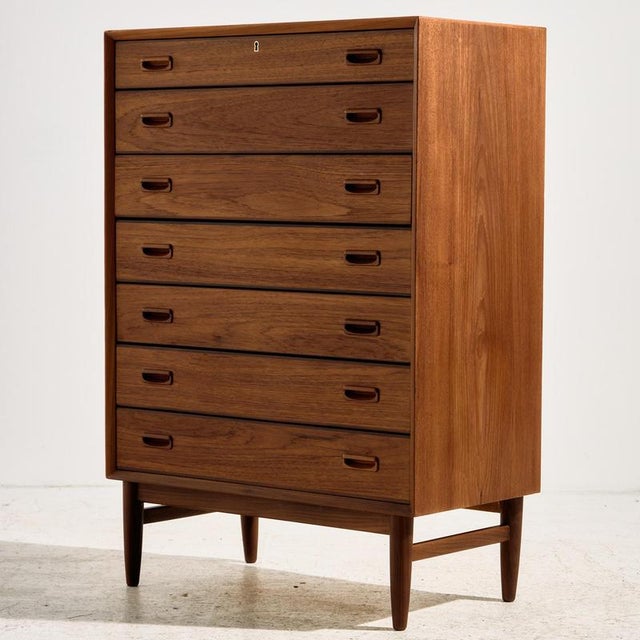 Restored Danish teak dresser with seven drawers and unique handles from the 1960s. Exciting shades of teak, clean details...