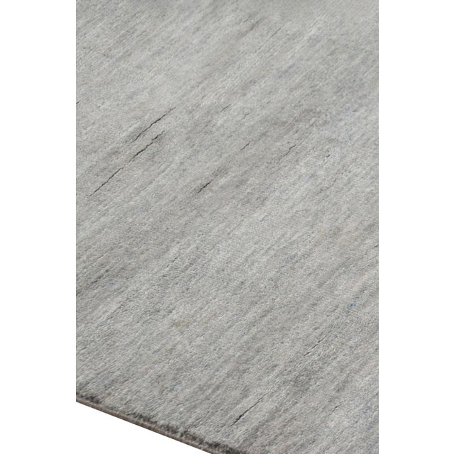 Hand-knotted in a luxurious blend of wool and silk, this 8x10 rug is a rich new addition to Rug & Kilim’s Textural rug...