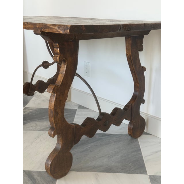 Beautiful rustic Spanish/Mediterranean style console table featuring a substantial wood plank top,carved wooden legs and...