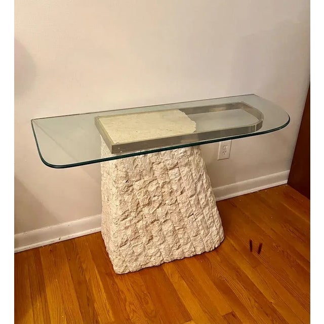 Gorgeous Postmodern 1980s design, freeform tessellated stone entry or sofa table with textured stone base. The glass piece...