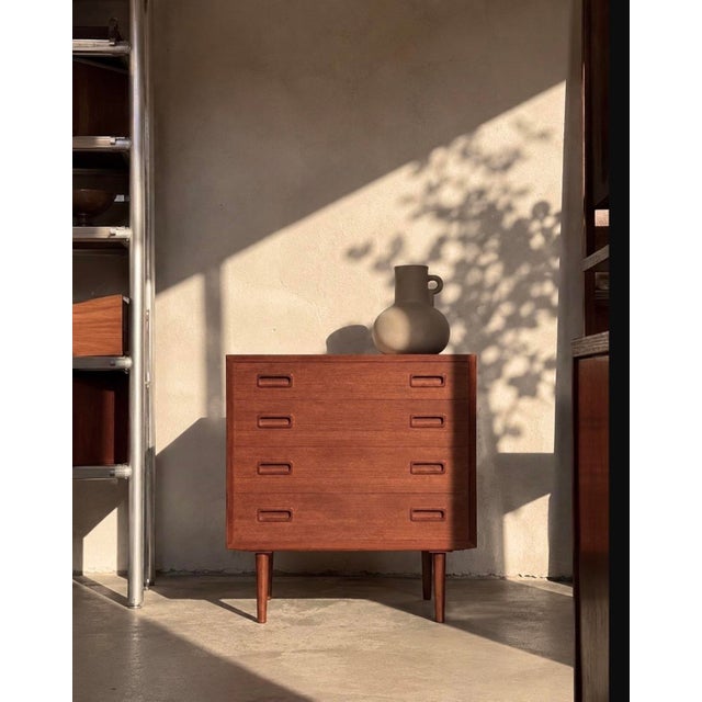 Danish chest of drawers produced by poul hundevad in denmark during the 1960s. executed in teak with oak legs and...
