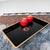 This refined Japanese obon tray is entirely finished in deep black urushi lacquer. Its high gloss and clean, slightly...