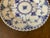 Distinct open work lace border and sculpted fish scale pattern around edges; traditional use as a bread, butter, side or...