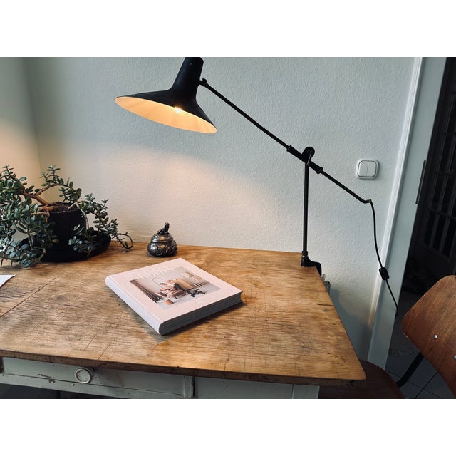 This striking Italian clamp-on desk lamp is a beautiful example of mid-century design and is attributed to the renowned...
