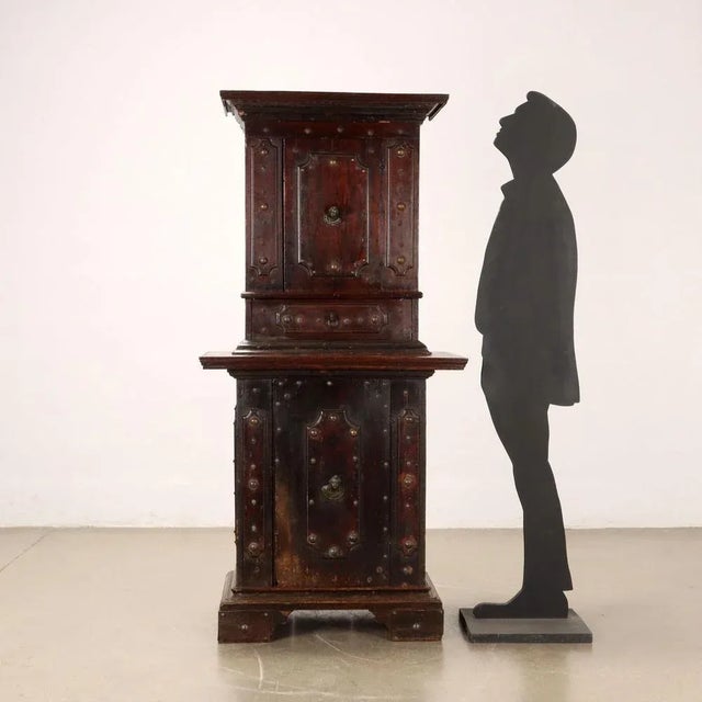 Cupboard with neo-Baroque walnut wall unit, Emilia Romagna late 19th century. The wall unit, with a door and drawer on the...