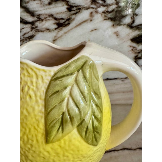 Vintage yellow and green lemon shaped hand painted ceramic pitcher. No maker’s marks.