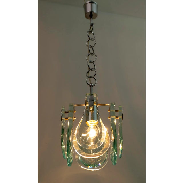 Hanging lamp in Max Ingrand style, produced in Italy by Veca in the 60s. Eight drops of thick glass with chromed metal...