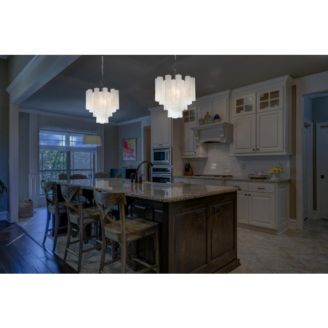 Italian vintage glass chandelier with alabaster white glass tubes. The armor polished nickel supports 36 large glass tubes...