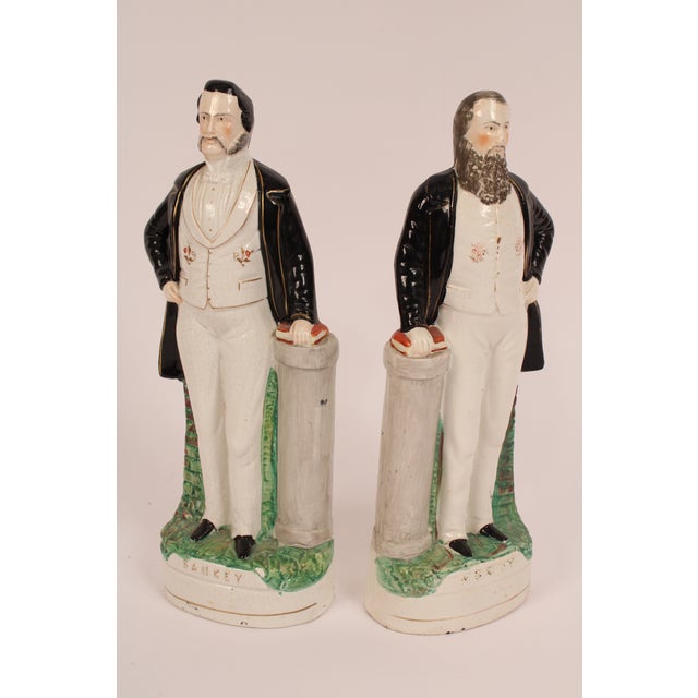 Pair of 17" tall Staffordshire figures of Dwight Moody and Iran Sankey, late 19th century. Moody was a preacher and Sankey...