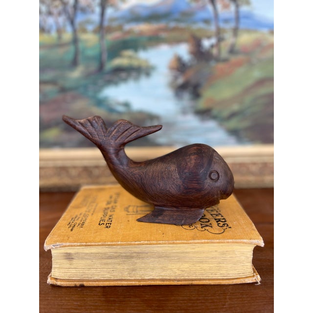 This sculptural whale figure is a finely hand-carved piece crafted from what is likely solid walnut, dating possibly to...