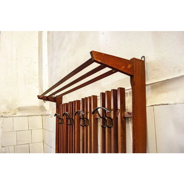 Coat walnut wooden wall, with metal details. Italian Production 50s