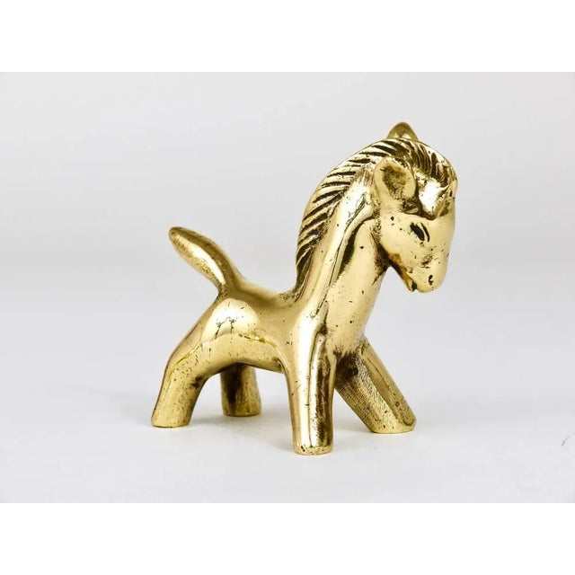 A lovely horse foal sculpture made of brass from the 1950s. Designed by Walter Bosse, executed by Hertha Baller. In good...