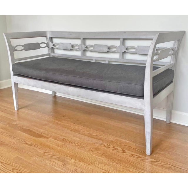 Antique 19th-century Swedish Gustavian-style bench with a graceful neoclassical silhouette, carved back detail, shaped...