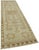 This exquisite runner rug is a rare example of tribal craftsmanship, hand-knotted by the women of the Herki tribe during...