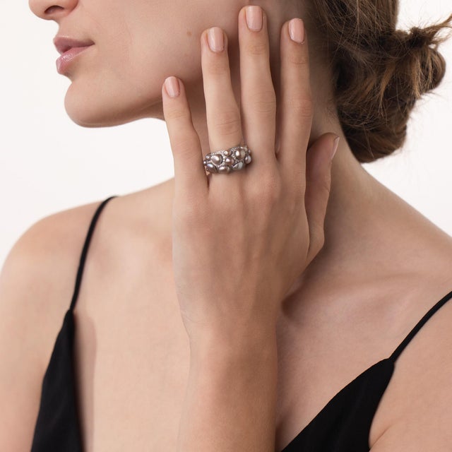 This elegant Monili natural pearl and diamond cluster ring is a refined vintage design from the 2000’s, featuring 15...