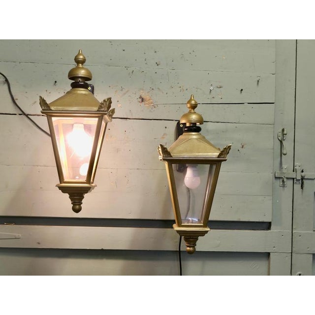 A Pair of Grand Wall Hung Lanterns These are old pub lights, the Large Wall Lanterns are made in metal which has been...