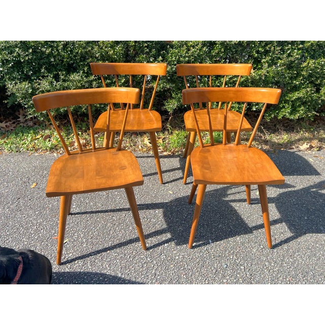 A set of four dining chairs Designed by Paul McCobb's iconic for Winchendon Furniture Planner Group series, manufactured...