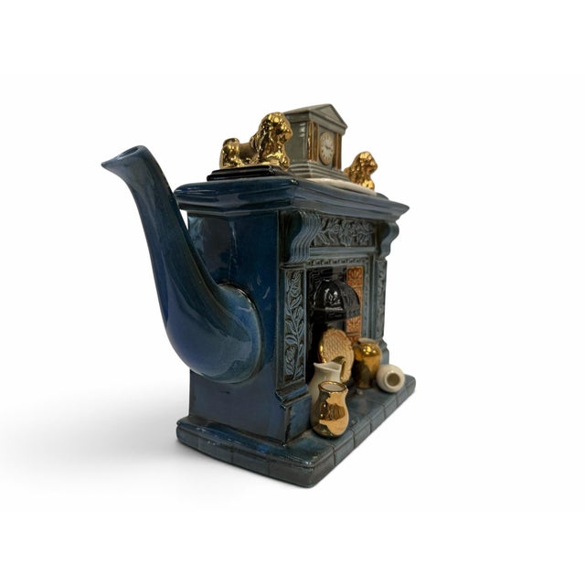 The teapot body, spout, main handle, and internal structure are fully sound and free of cracks. There are two localized...