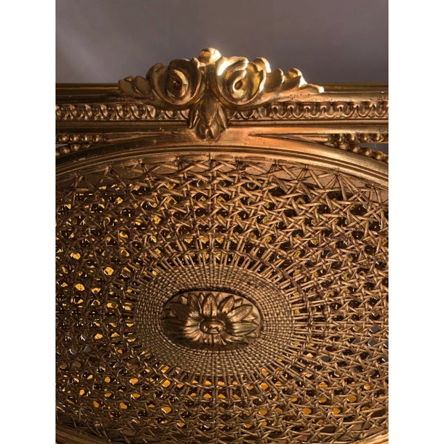 Breathtaking Louis XV gold gilt magazine rack . Double caned, oval medallions, rams hoof feet . Measures 32” h x 20” w x...