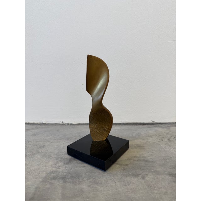 Brazilian modern abstract bronze sculpture on black acrylic base, 1990s.