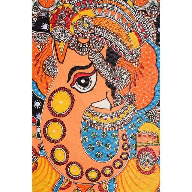 Celebrate the beauty of traditional Indian folk art with this vibrant, hand-painted Madhubani painting of Lord Ganesha by...