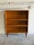 Featuring clean lines and open shelving, this piece offers functional storage with minimalist charm. Simple tapered legs...