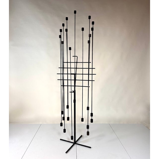 A rare kinetic light sculpture attributed to the artist Daniel Grobet (1936-2017). The artist created a series of...