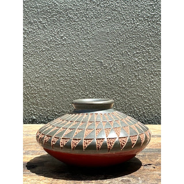 This exquisite vintage studio pottery vase is a masterclass in textural design and geometric precision. Featuring a...