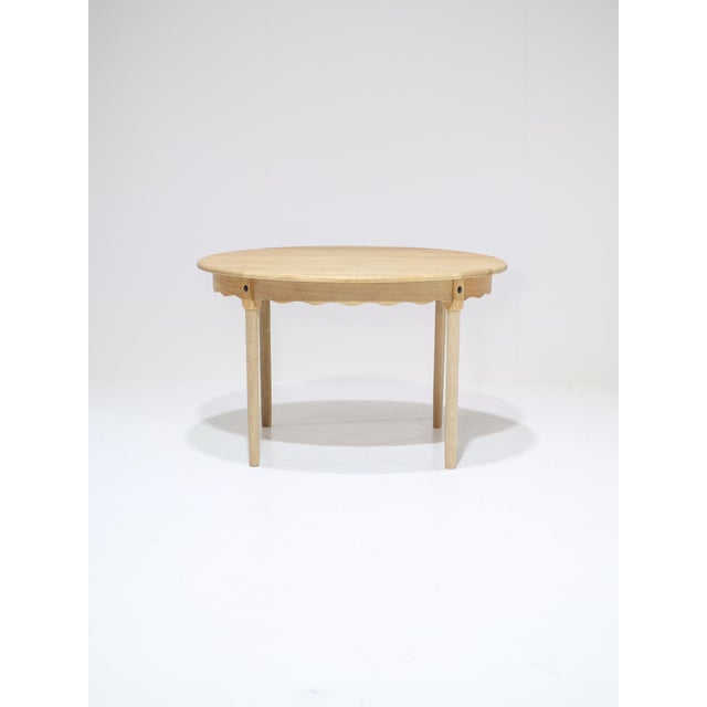 Beautiful round/oval extendable dining table designed by Henning Kjaernulf in Denmark in the 1960s/70s. This table is made...
