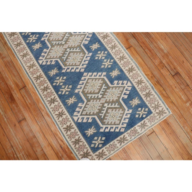Mid 20th century turkish runner in denim blue, accents in beige and off white