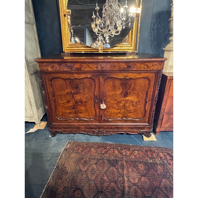 Handsome 19th century French walnut buffets. Featuring a gorgeous finish and carved details. Makes a beautiful statement!...