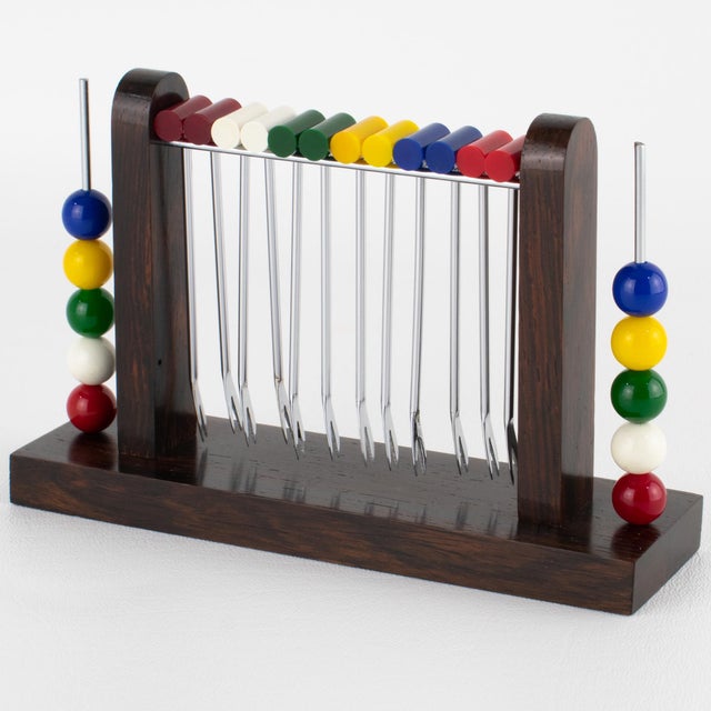 This stunning Art Deco cocktail picks set features a miniature croquet game. The barware piece was expertly crafted in...