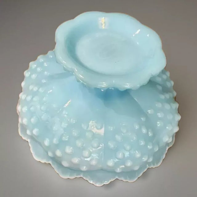 Add a striking touch of vintage charm to your collection with this Fenton Blue Slag Hobnail Candle Bowl. Featuring...