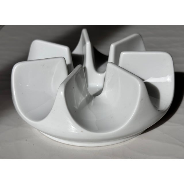 A vintage porcelain candle holder by Arzberg of Germany. It has a sleek modern pinwheel-type design that casts very unique...
