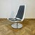 Vintage XPO Swivel Chair by BO Concept on Chrome Base. The chair, which is super heavy, boasts faux grey leather seat pads...