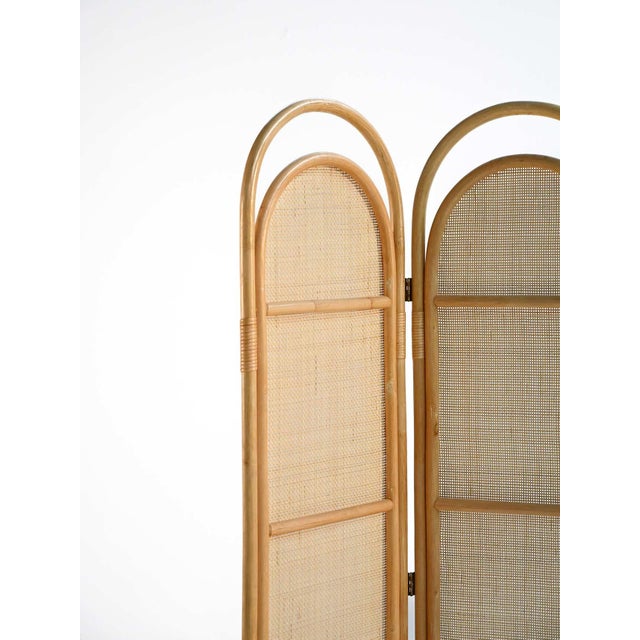 Three-panel folding screen in bamboo with woven rattan panels. This Scandinavian folding screen dates back to the second...