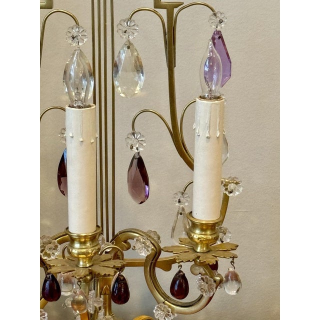 This exquisite pair of antique bronze French candelabra lamps is a true gem from the 1920s. The lyre back design adds an...