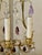 This exquisite pair of antique bronze French candelabra lamps is a true gem from the 1920s. The lyre back design adds an...
