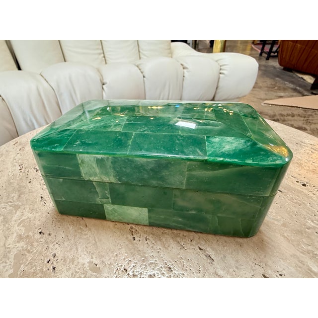 Elegant rectangular decorative box clad in richly variegated green stone tiles, featuring softly rounded corners and a...