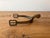Kick up the equestrian vibes in your décor with this single antique brass horse riding spur, possibly attributed to...