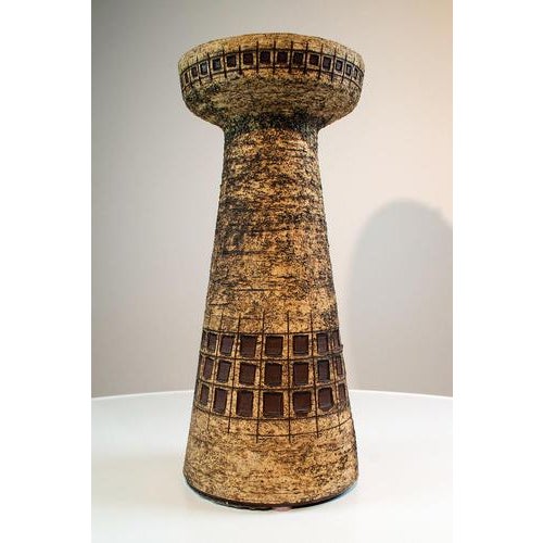 Vase marked Emella Besigheim. The vase has a structure on the outside and is glazed on the inside. The opening of this...