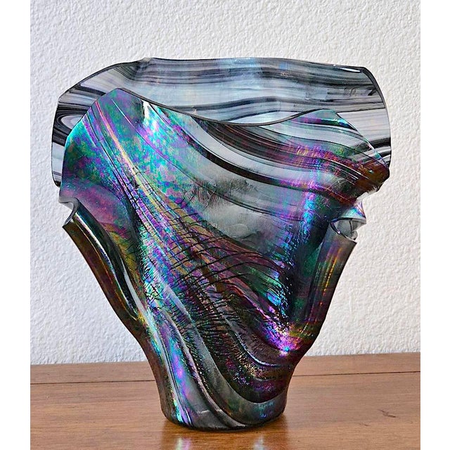 Add instant artistry to your space with this captivating hand-blown art glass vase in the iconic handkerchief (drape)...